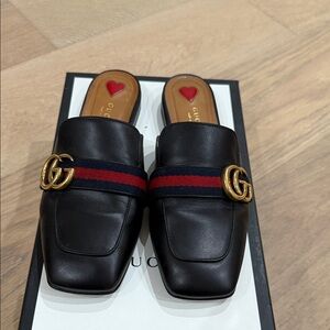 Pre loved authentic Gucci Black Leather Mules with Gold Accent